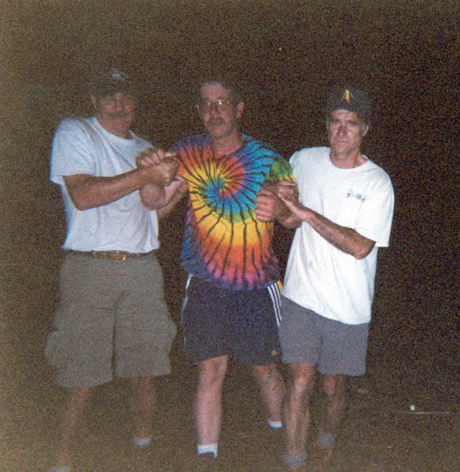 Tom with kids at camp