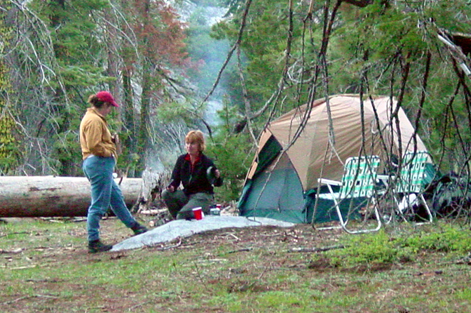 Three women in conversation at camp, 2005