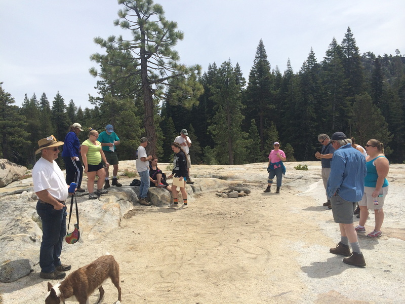 The group assembled on the granite overlooking the Island campsite for Tom Caton's memorial, 2014 Kegger Backpack